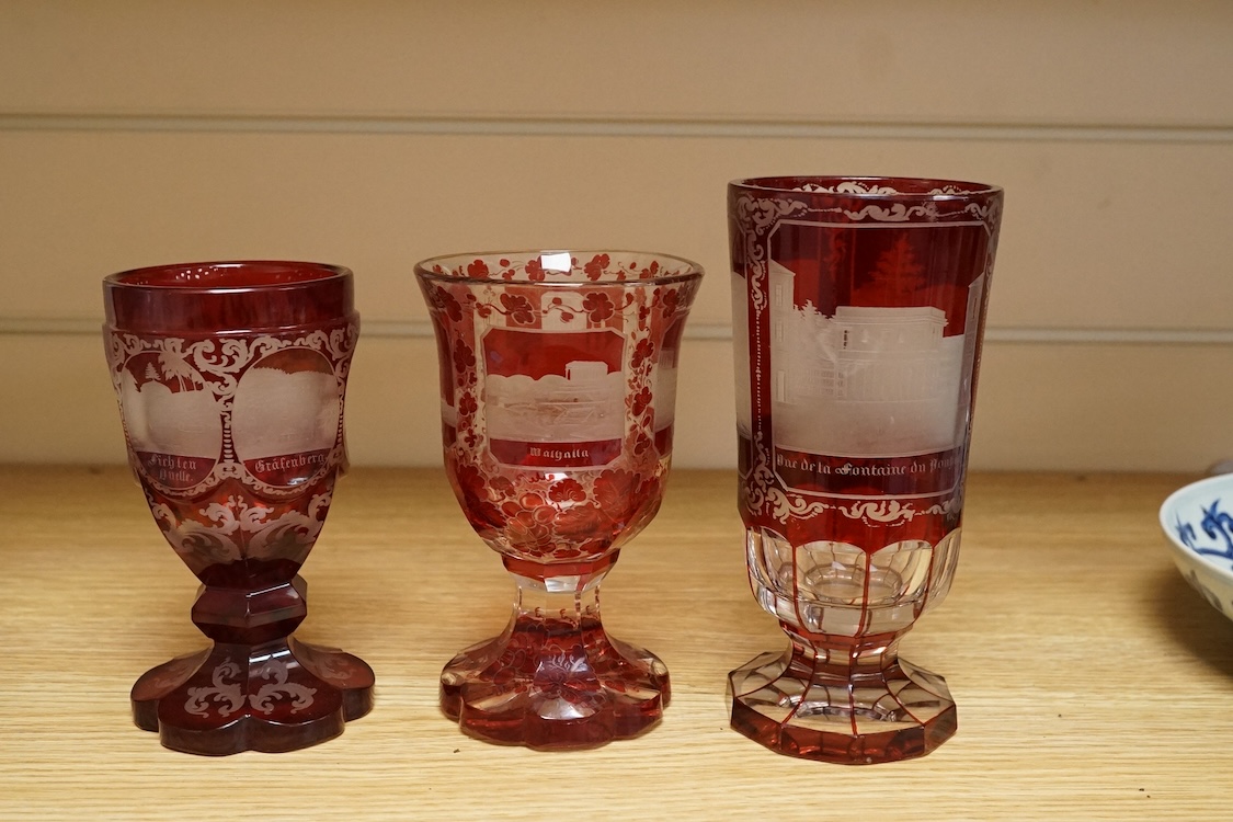 Three Bohemian topographical engraved ruby flashed spa glasses, late 19th century, largest 16cm high